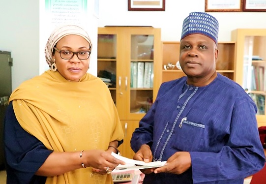 General Manager, Legal Regulatory and Compliance Services, NIMC, Mrs. Hadiza Ali-Dagabana, with the Director General, NCAA, Captain Muhtar Usman, after enrolling for his NIN